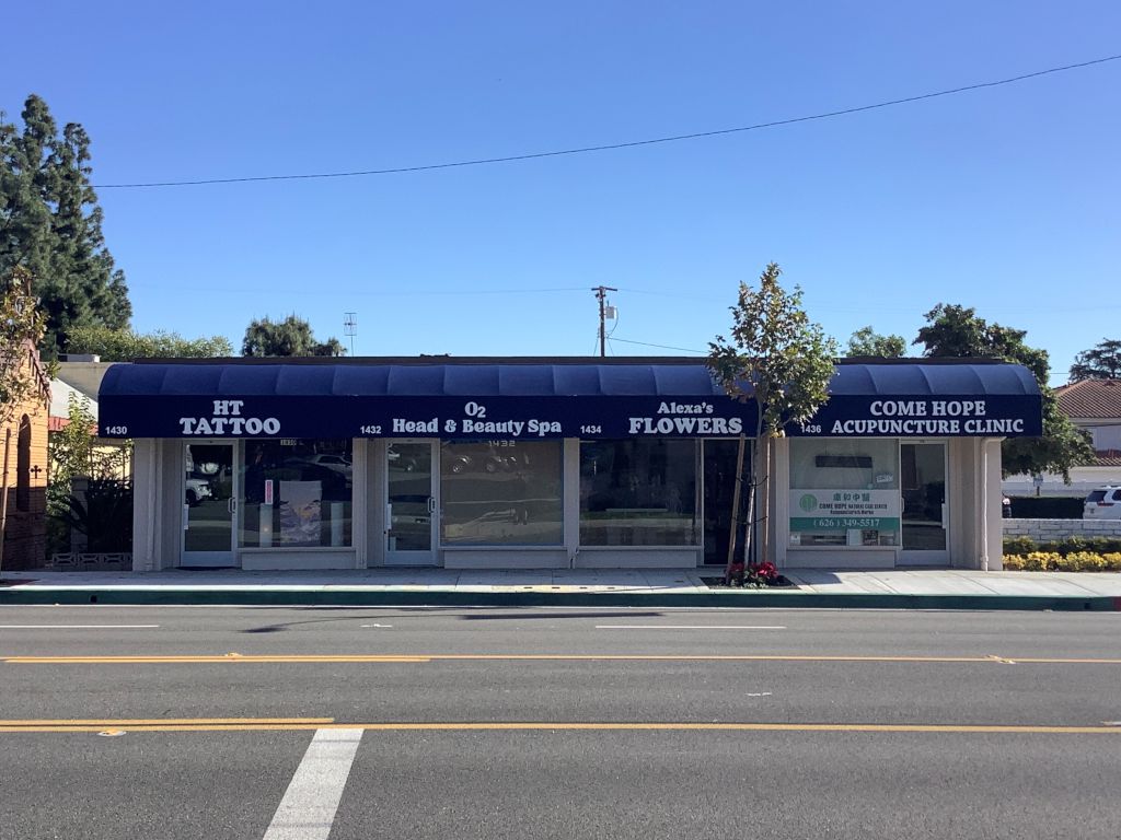 Small business grant after with businesses blue matching awnings